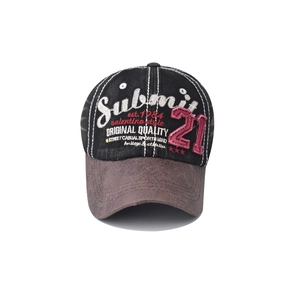 Detail of vintage washed denim baseball cap with multi-color embroidery and leather brim