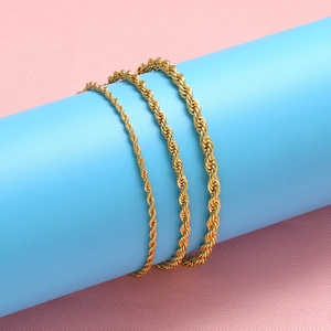 Three gold-plated stainless steel rope chains in various thicknesses on blue stand