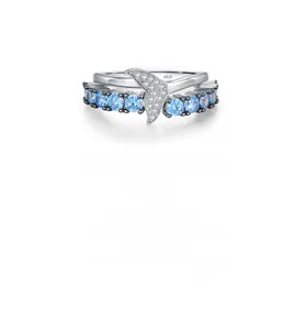 Detailed macro shot of S925 sterling silver mermaid tail ring with blue sapphire stones