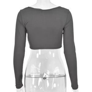 Back view of dark gray ribbed long sleeve crop top with stylish cutout details