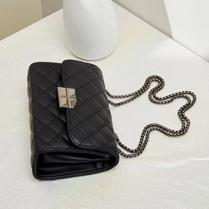 Classic black quilted leather crossbody bag with silver chain strap and metal lock