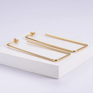 Minimalist rectangular gold titanium steel hoop earrings with polished finish and open design