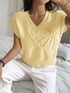 Yellow knit vest with deep V-neck and 3D flower embroidery on the shoulder
