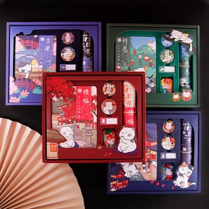 Detailed close-up of cat-themed stationery gift set with notebook, stickers, and tapes