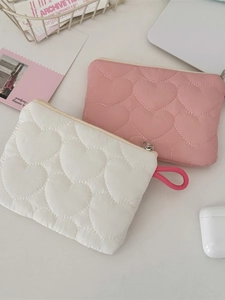 Quilted heart pattern mini cosmetic bag in pink and white with zipper closure