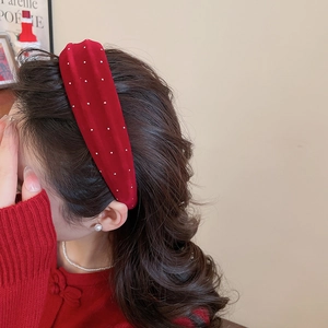Detail showing red velvet headband with rhinestones for a vintage winter hair style