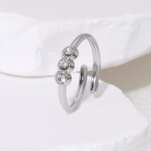 Elegant 18K gold-plated titanium steel ring with three sparkling cubic zirconia stones