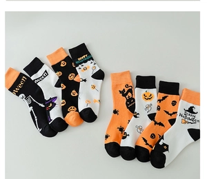 Detail showing knitted Halloween socks with pumpkin, skull, and ghost holiday patterns