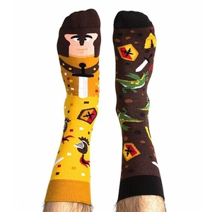 Asymmetric cartoon socks featuring yellow knight and brown dragon motifs on white background
