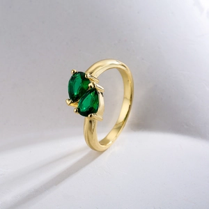 Elegant 18K gold plated copper ring featuring dual pear-shaped green zircon stones