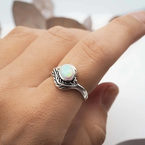 Vintage silver branch ring with leaf relief design and oval fire opal gemstone