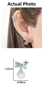 Detail of blue zircon bow shell cartilage stud showing dimensions and ear placement