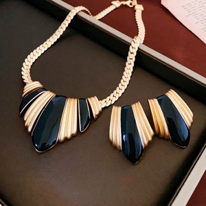 Vintage gold and black enamel teardrop jewelry set with necklace and earrings