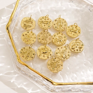 12 Zodiac hammered coin pendants in 14K gold-plated stainless steel with colored crystals