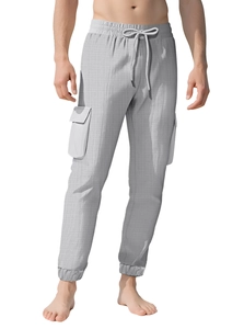 Detail of light gray plaid cargo pants featuring drawstring waist and elastic cuffs