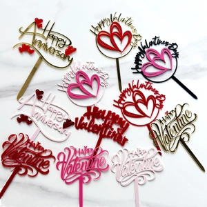 Acrylic Happy Valentine's Day cake toppers in multiple colors on marble background