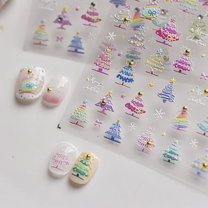 Macro view of 5D embossed Christmas tree nail stickers with gold bead decorations