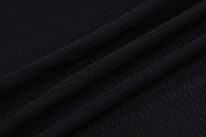 Detailed close-up of high-quality black mesh fabric texture and pleated material finish