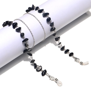 Detail of silver eyewear chain featuring natural black stone beads and non-slip rubber loops