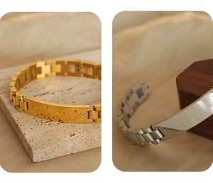 Detail of gold hammered finish and silver polished square plates on watch-link chain bracelets