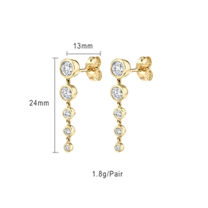 Detailed view of long gold tassel earrings with white diamonds showing 24mm length size