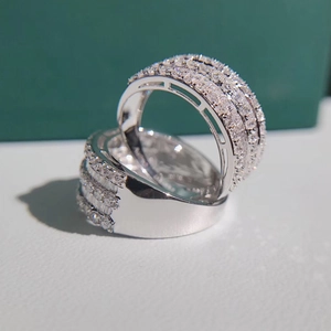 Macro close-up of glittering multi-row cubic zirconia inlay on silver wedding ring