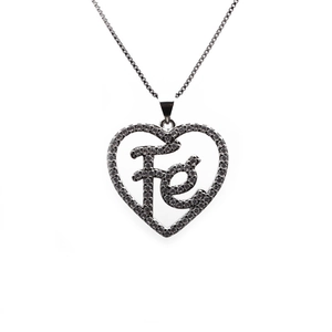 Detailed close-up of a silver heart pendant with Fe letters and micro-pave crystals
