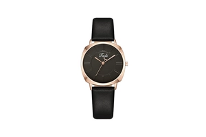 Detail of a square women's watch featuring a black leather strap and rose gold case