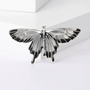 Vintage alloy butterfly brooch pin with black drip oil enamel finish on silver base
