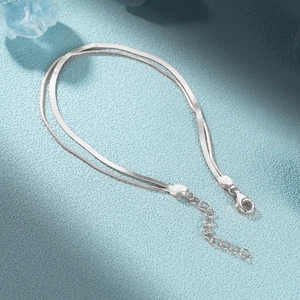 Detail of 925 sterling silver double layer bracelet with snake chain and lobster clasp