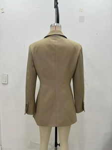 Detailed back view of a khaki slim-fit blazer showing premium twill fabric texture
