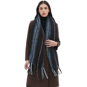 Classic black knitted scarf with colorful striped pattern and fringe tassels for winter