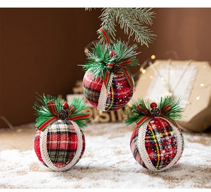 Detailed view of rustic linen Christmas balls with pine cones and red berries ornaments