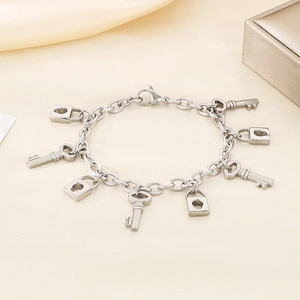 Silver lock and key charm bracelet in stainless steel with elegant lobster clasp