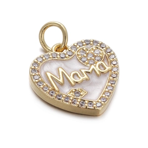 Close-up of a gold heart pendant with Mama lettering, white shell, and clear zircons