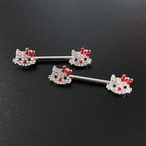 Detailed view of silver nipple rings featuring sparkling rhinestone kitten head designs