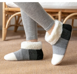 Detail of tricolor knitted indoor floor socks with fleece lining and plush white collar