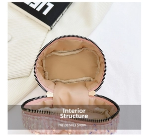 Detail view of pink sequin crossbody bag with internal lining and smooth zipper closure
