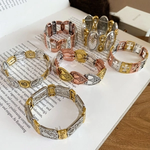 Close-up of six vintage stretch bracelets with inspirational words like Love and Faith