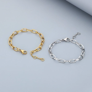 Detail of gold and silver paperclip link necklaces with lobster clasp and extension chain