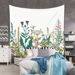 Detailed view of large vintage botanical tapestry hanging on a rustic bedroom wall