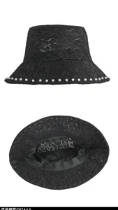 Close-up of black lace sun hat showing pearl edge trim and floral hollow mesh texture