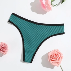 Detail of teal ribbed cotton thong with black contrast binding on a clean white surface