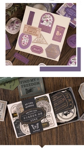 Macro detail of vintage floral stickers and butterfly motifs on dark wood background