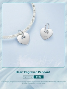 Close-up of S925 sterling silver heart charm with mirror finish on a mesh bracelet