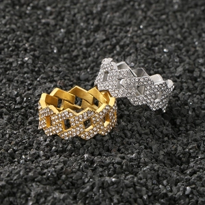 Close-up of gold and silver hip hop link rings with sparkling pavé rhinestones