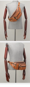 Brown crocodile pattern waist bag displayed on wooden mannequin as chest and hip pack