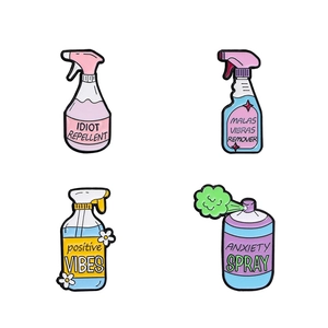 Set of 4 creative enamel pins featuring cartoon spray bottles with humorous typography