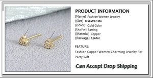 Detailed view of heart-shaped copper stud earrings with gold plating and zircons
