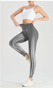 Close-up of high-waisted seamless yoga leggings with metallic finish and ribbed texture